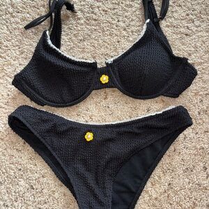 Elegant Black Textured Bikini with Floral Accent